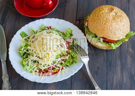 Salad, A Burger And A Cup Of Coffee For Breakfast