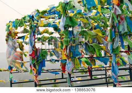 Prayer flags and Hadak at sunset in the Republic of Buryatia. Datsan Rinpoche Bagsha on Bald Mountain in Ulan-Ude, Russia.