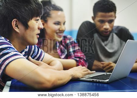 Teenage Using Laptop Surfing Internet Concept
