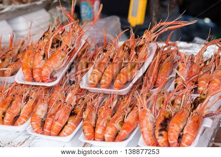 Grilled shrimp. grilled shrimp in foam box. Grilled big river prawn on foam box for sell in bangkok market.