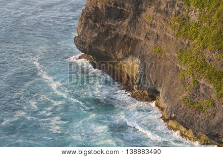 Waves at the cliff of a mountain in Bali