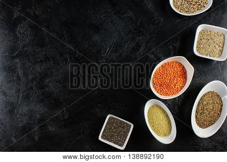 super food in bowls on dark ground