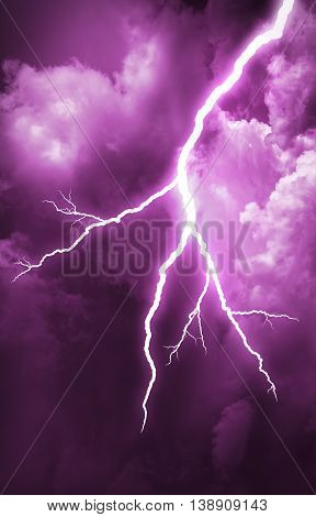 Lightning strike on the cloudy dark sky.