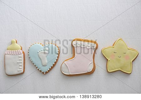 Delicious baby shower cookies on table