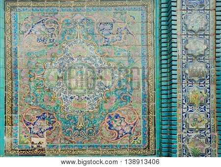 KERMANSHAH, IRAN - OCT 12, 2014: Old tiles with traditional Persian patterns on historical mosque on October 12, 2014. With population of 855000, Kermanshah developed in the 4th century AD by Sassanian kings
