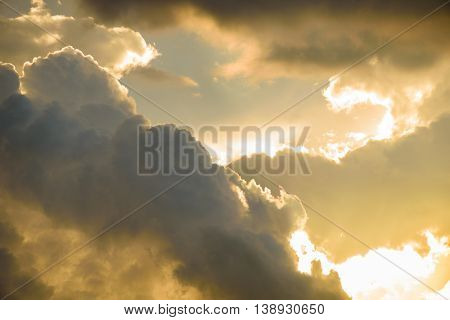 Background Of Golden Storm Clouds At Sunset.