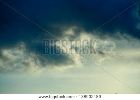 Background Of Golden Storm Clouds At Sunset.