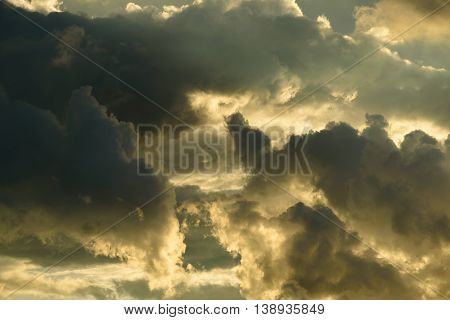 Background Of Golden Storm Clouds At Sunset.