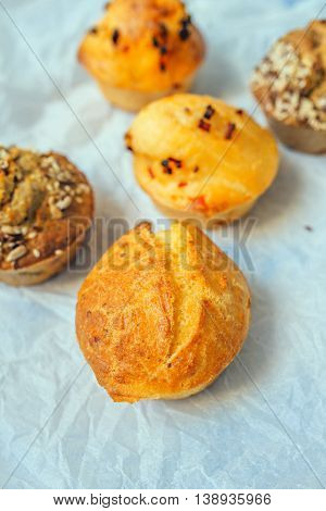 Homemade salty muffins also called proja pie traditional Balkans baked food with savory cheese ham eggs and paprika made of corn flour starch selective focus.