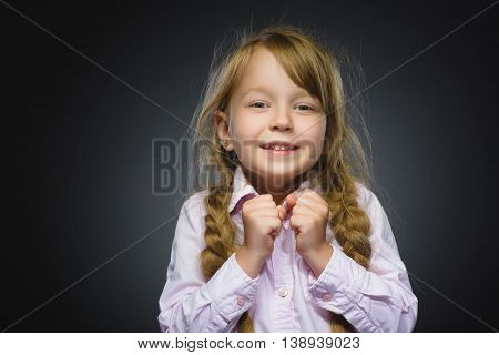 Closeup Portrait of happy girl going surprise isolated on gray background.