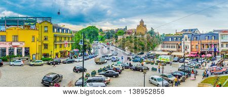 TBILISI GEORGIA - MAY 28 2016: The Square of Vakhtang Gorgasali with the large parking in the middle on May 28 in Tbilisi.