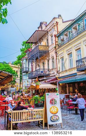 TBILISI GEORGIA - MAY 28 2016: Many of old town's streets occupied with family restaurants and cafes offering the tasty dishes and local wine on May 28 in Tbilisi.