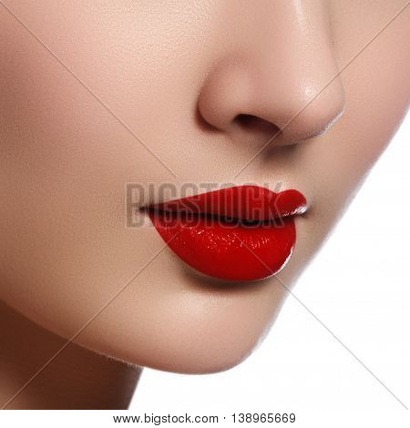 Close-up Shot Of Woman Lips With Glossy Red Lipstick