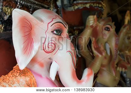 KOLKATA WEST BENGAL INDIA - 13 SEPTEMBER 2015: Beautiful fresh painted clay idol of Lord Ganesha at Kumartuli as preparation for "Durga Puja' festival in Kumartuli Kolkata capital of West Bengal India. It is the biggest festival of Hinduism.