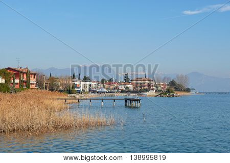 landscape of coastline of Sirmione in a winter. Sirmione is a famous vacation place in the northern Italy.
