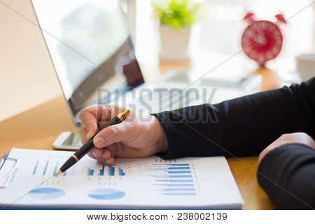 Close Up Business Woman Sitting In The Office Graph.