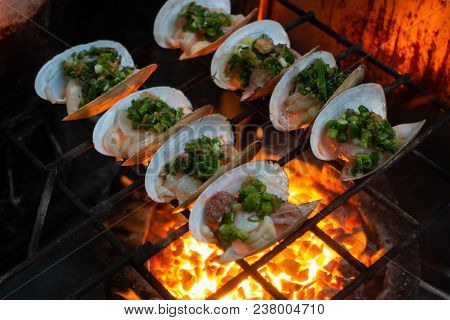 Grilled Oysters On Fire With Oil, Green Onion, Roasted Peanut