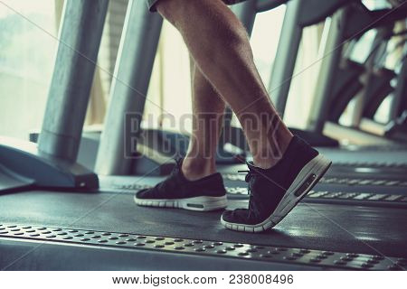 Athlete Warming Up On Threadmill In Gym