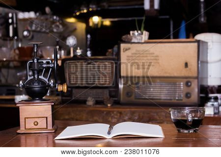 Hot Coffee With Notes On Wooden Background At Coffee Shop