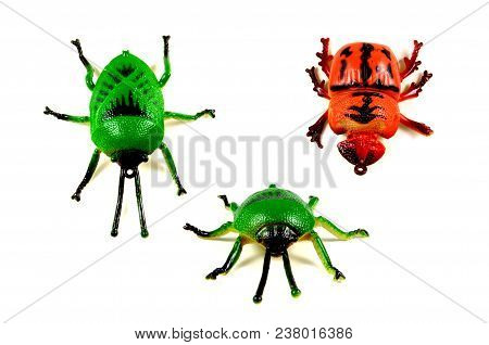 Rrubber Toy Beetle, Red And Green On A White Background