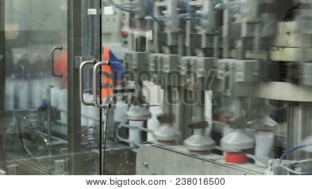 Packed Bottle Moving On Conveyor Belt. Plastic Bottle On The Conveyor.