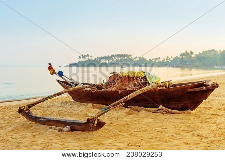 Wooden Fishing Boats At Dawn On The Beach. Tinted.