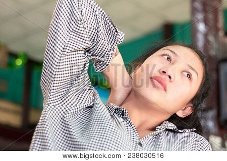 Businesswoman Working Hard Until Neck Pain In The Coffee Shop.
