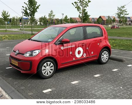 Almere, Flevoland, The Netherlands - March 17, 2018: Red Volkswagen Up From Greenwheels, The Largest