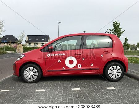 Almere, Flevoland, The Netherlands - March 17, 2018: Red Volkswagen Up From Greenwheels, The Largest