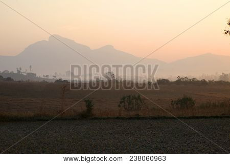 Foggy Mountain Valley At Sunrise In The Village In Nasik, Maharashtra, India