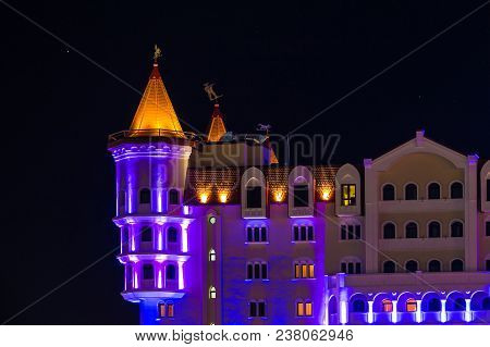 Adler, Sochi, Russia - December 9, 2017: Night Illuminated Part Of The Facade Of Bogatyr Hotel In Th