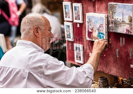 Paris, France - July 06, 2017: The Painter Works At The Open Air Artist Market At The Tertre Square 