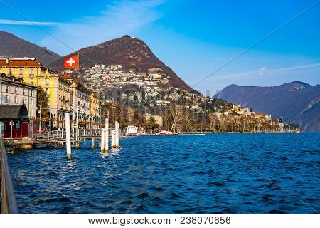 Lugano, Switzerland - March 25, 2018 : Coastal Landscape Of Lake Lugano And The Town Of Lugano The L