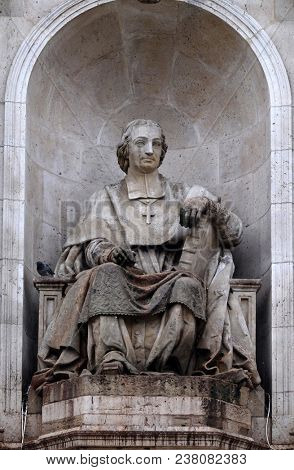 PARIS, FRANCE - JANUARY 04: The statue of Massillon by Jacques Fauginet, Fountain of the Sacred Orators, Place Saint Sulpice in Paris, France on January 04, 2018.