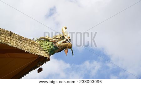 Brass statue on the roof with sky