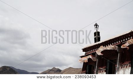Brass Statue On The Roof With Sky
