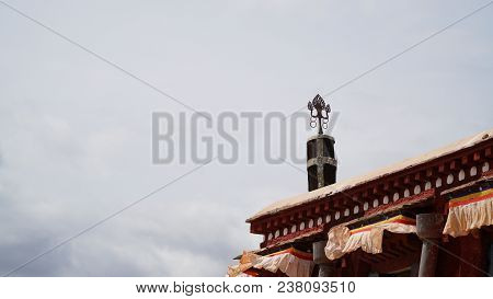 Brass Statue On The Roof With Sky