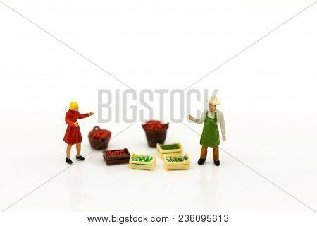 Miniature People : Spending Cash For Shopping In The Market. Image Use For Marketing, Merchant Middl