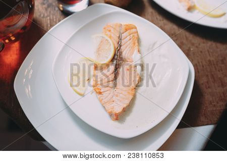 Hot Dish With Meat, Restaurant, White Plate. Red Fish