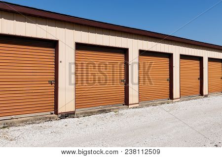 Brown Numbered Self Storage And Mini Storage Garage Units