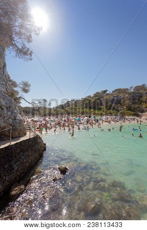 Cala Llombards, Mallorca, Spain - August 2016 - People Enjoying Their Vacations During Sunset At The