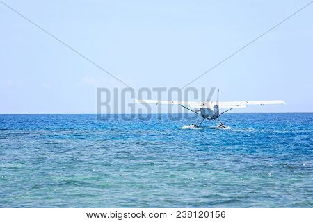 Seaplane Landing On Water, Copy Space On Left
