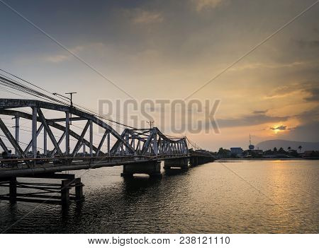 Landmark Old Bridge And River At Sunset In Kampot Cambodia