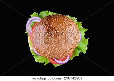 Burger Isolated On Black Background. Fresh Tasty And Appetizing Cheeseburger. Vegetarian Burger Top 