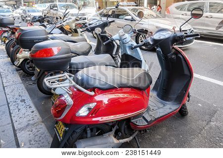 Sydney, Australia - Nov 14, 2017: A Row Of Scooters Parked Along Market Street. Behind Features Vehi