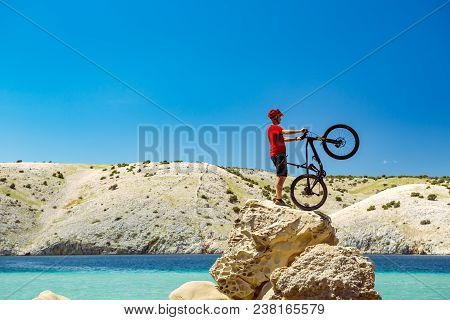 Mountain Biker Looking At View And Traveling On Bike, Sunny Summer Day At Seaside. Man Relaxing And 