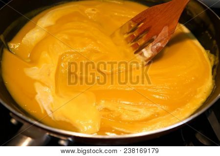 Someone Is Cooking Some Pumpkin Soup In The Pan