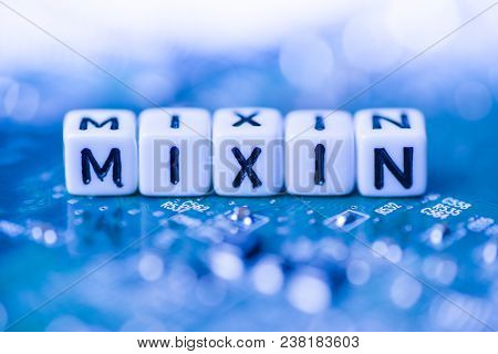 Word Mixin Formed By Alphabet Blocks On Mother Cryptocurrency Closeup