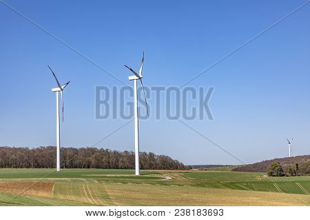 Wind Generator Produces Electric Power In Rural Landscape