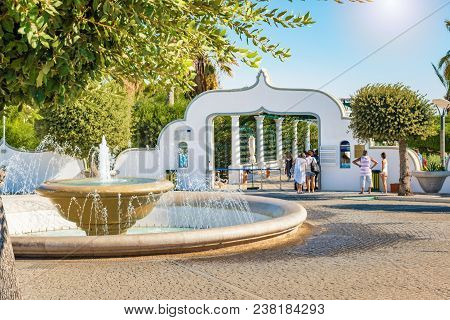 Circular Water Fountain Near Old Building (rhodes, Greece)